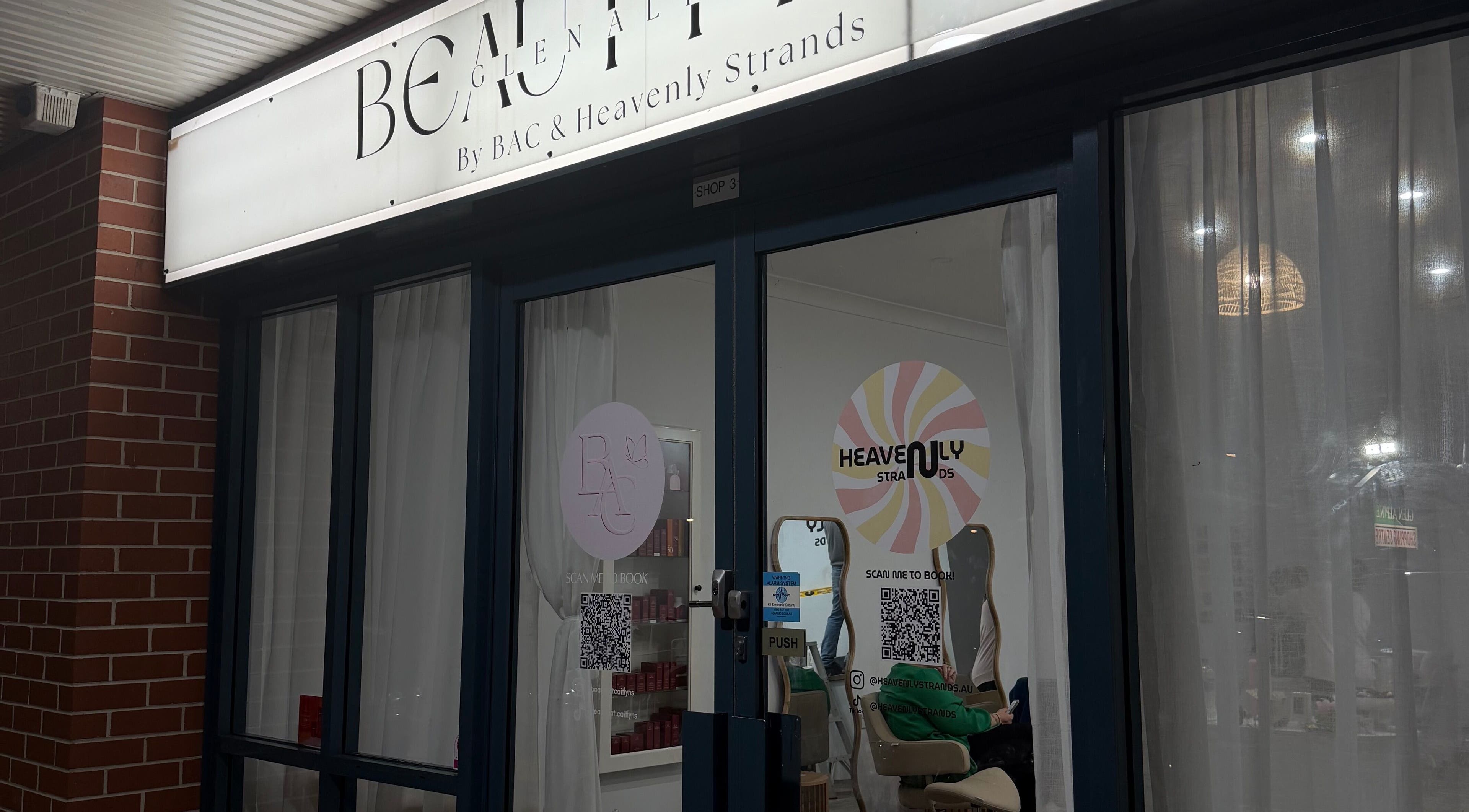 Entrance of Heavenly Strands salon in Glen Alpine, New South Wales, AU with elegant signage.