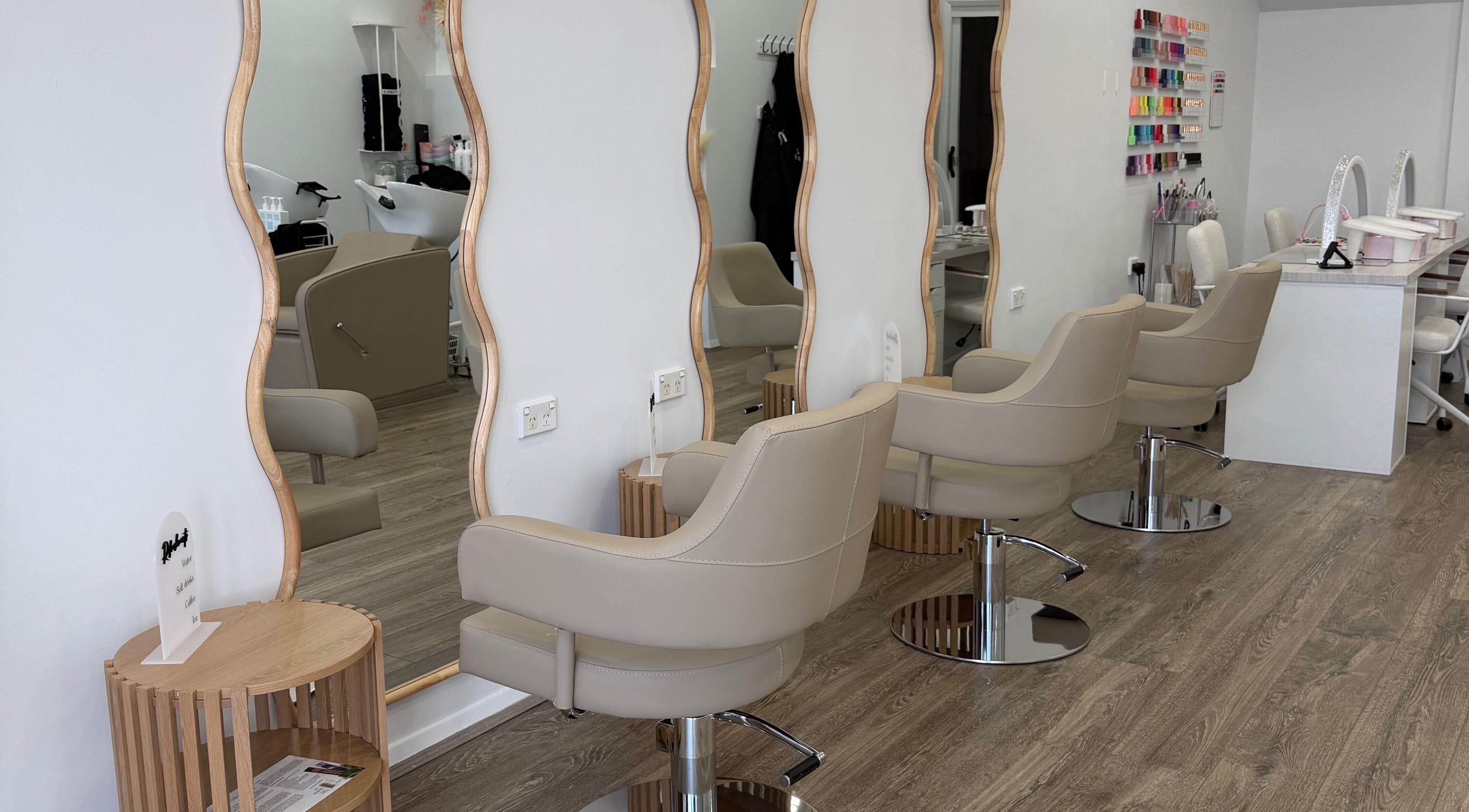 Chic salon interior with stylish chairs at Heavenly Strands, Glen Alpine, New South Wales, AU.