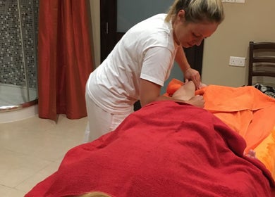 Therapist performing a soothing massage at Divine Therapy by Katarína in Ix-xagħra, MT.