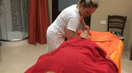 Therapist performing a soothing massage at Divine Therapy by Katarína in Ix-xagħra, MT.