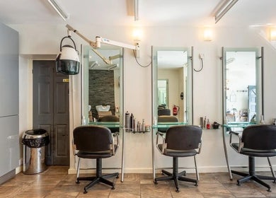 Modern styling chairs and mirrors at Valencia Salon, Newcastle upon Tyne, England, GB.
