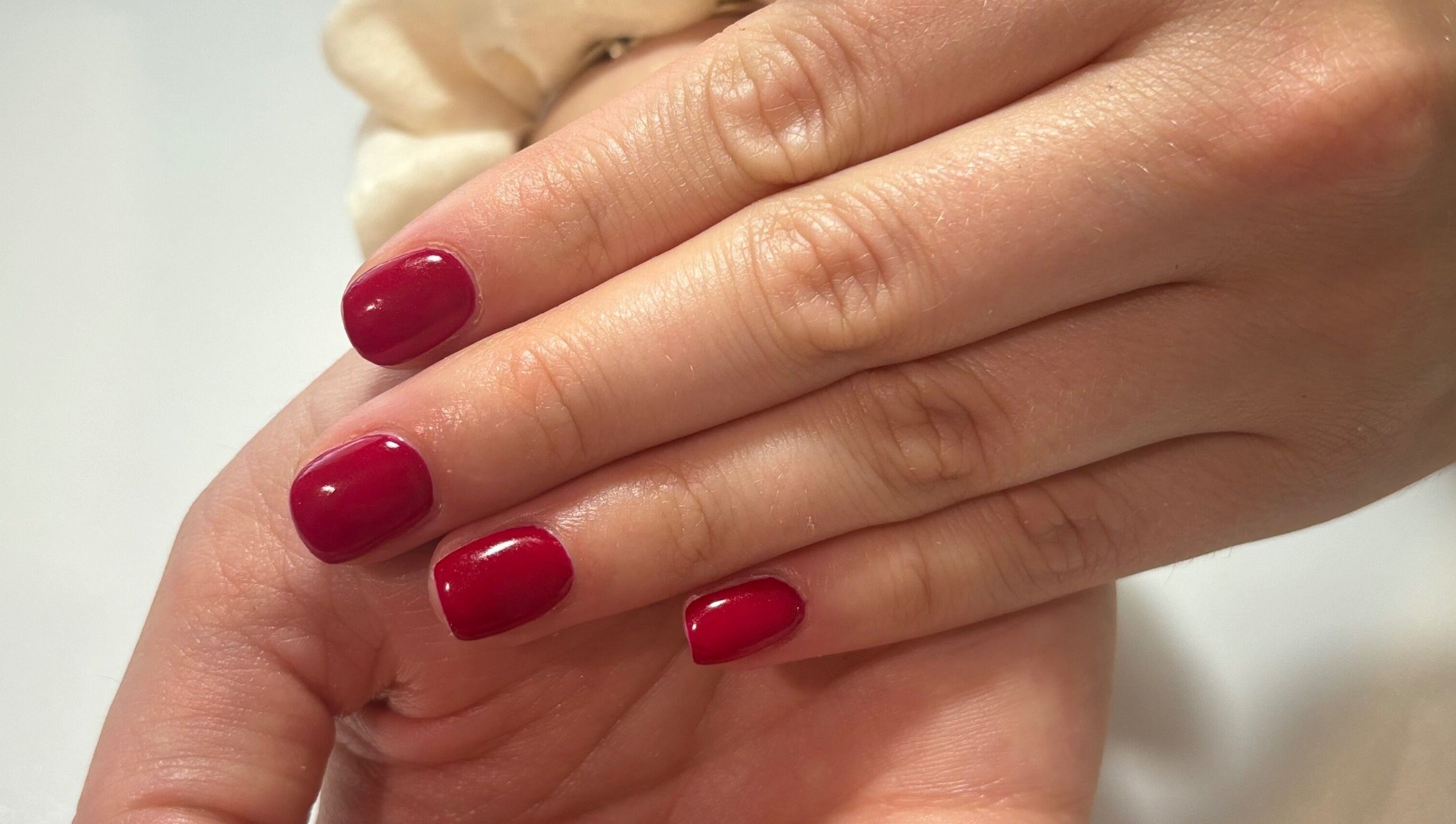Red manicure at Courtney’sbeautystudio in Keyworth, England, GB showcasing glossy nails with style.