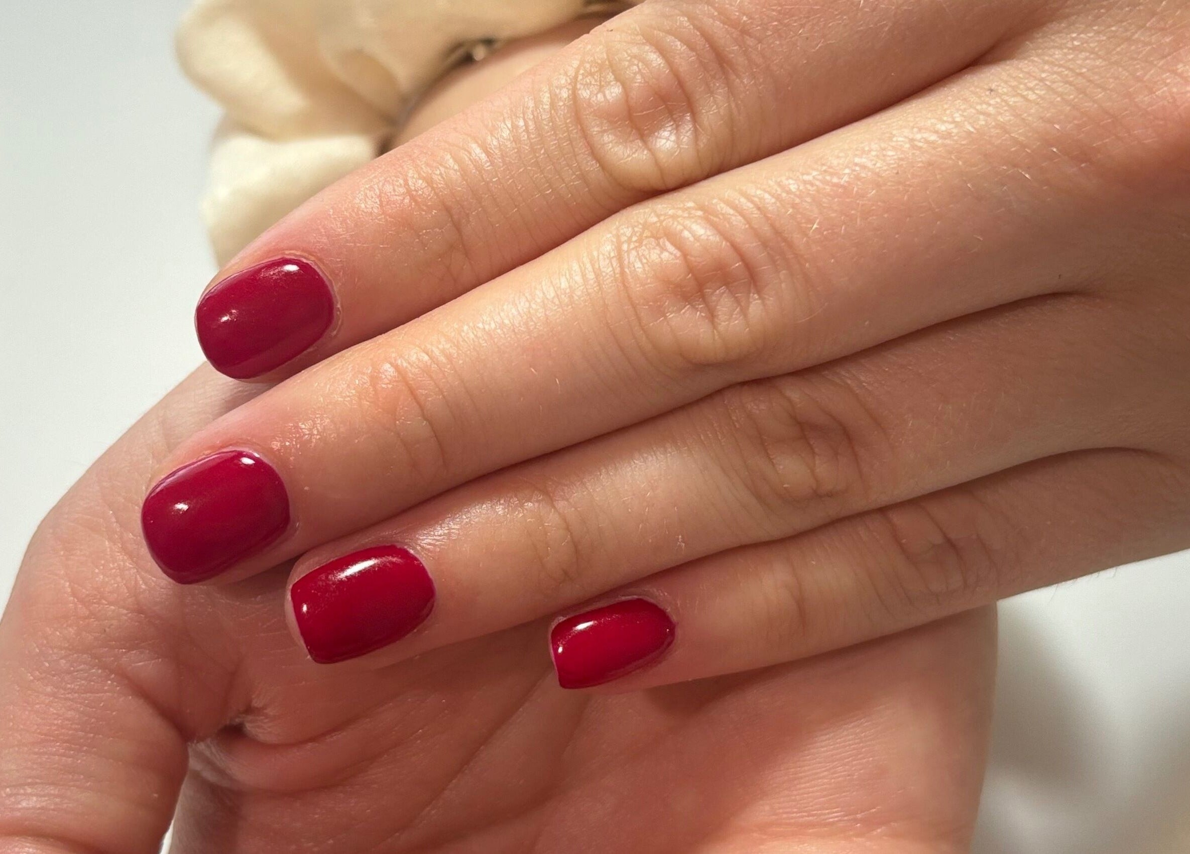 Red manicure at Courtney’sbeautystudio in Keyworth, England, GB showcasing glossy nails with style.