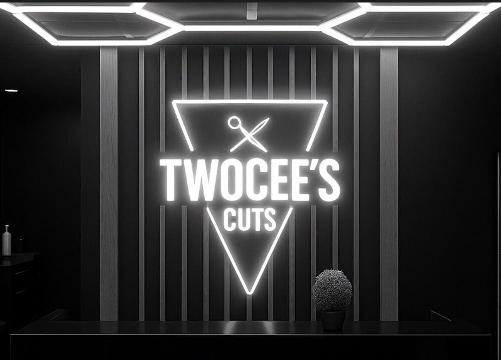 Twocees Cuts salon interior with illuminated sign in Stoke-on-Trent, England, GB.