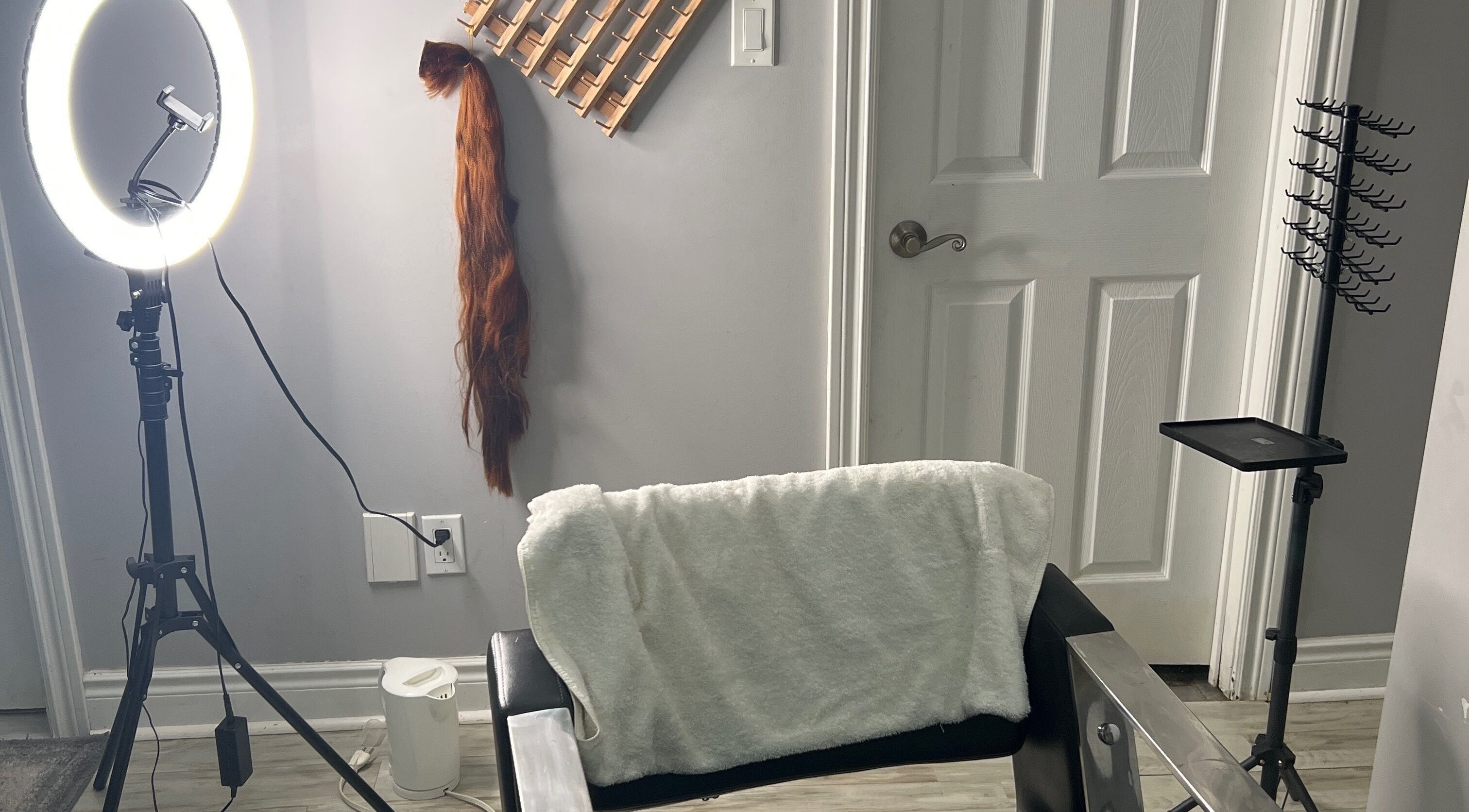 Professional styling station at Flemous Empire Enterprise, Ajax, Ontario, CA, featuring tools and chair.