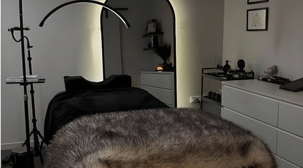 Luxurious treatment room at Fresh Glow Beauty, Melbourne, Victoria, AU, with soft lighting and plush decor.