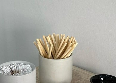 Minimalistic decor at Fresh Glow Beauty, Melbourne, Victoria, AU, featuring cotton swabs and bamboo sticks.