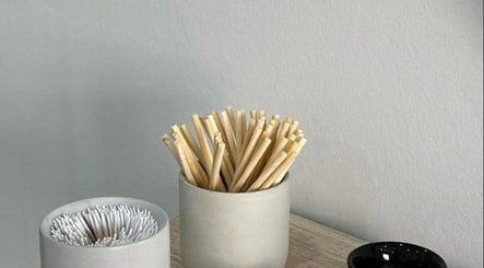 Minimalistic decor at Fresh Glow Beauty, Melbourne, Victoria, AU, featuring cotton swabs and bamboo sticks.