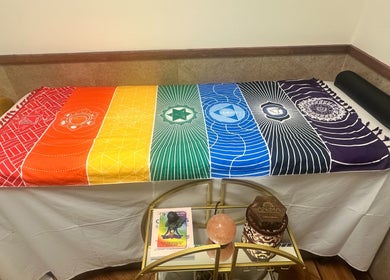 Colorful chakra blanket on massage table at Cynergi Healing Center, Worcester, Massachusetts, US.