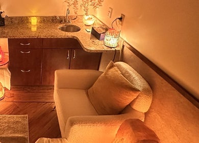 Cozy relaxation area at Cynergi Healing Center in Worcester, Massachusetts, US featuring warm lighting and plush seating.