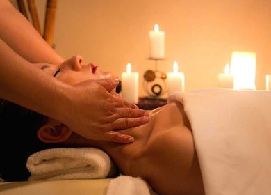 Relaxing massage at Blossom & Be Wellness Studio, Kigali, Kigali City, RW, with candles creating a soothing ambiance.