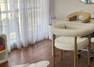 Elegant nail station at The Nail Station, Porepunkah, Victoria, AU with wooden chair and decor.