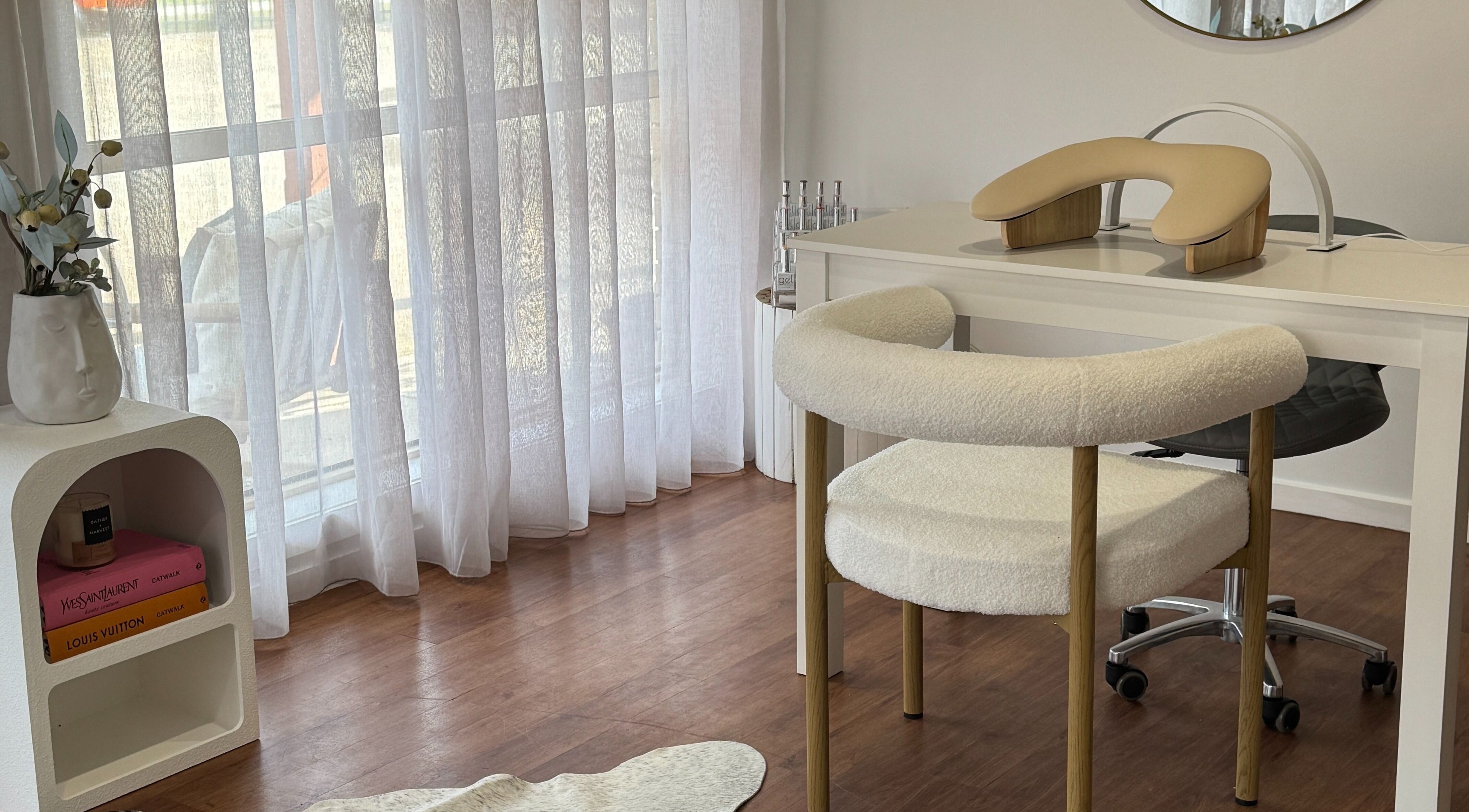 Elegant nail station at The Nail Station, Porepunkah, Victoria, AU with wooden chair and decor.