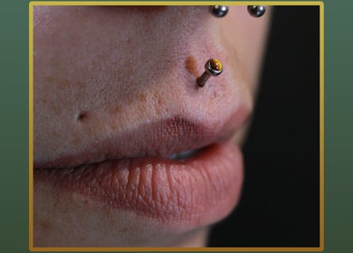 Close-up of nostril piercing at Gilded Touch Piercings, Glasgow, Scotland, GB showcasing precision and style.