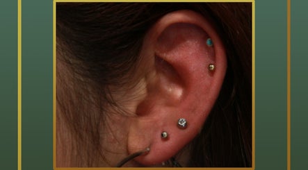 Elegant ear piercings at Gilded Touch Piercings, Glasgow, Scotland, GB showcasing unique jewelry.