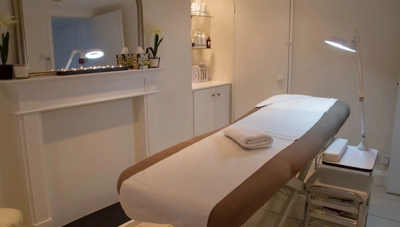 Luxe spa room at Lashes by ANNA in Richmond, England, GB, showcasing a tranquil massage table setup.