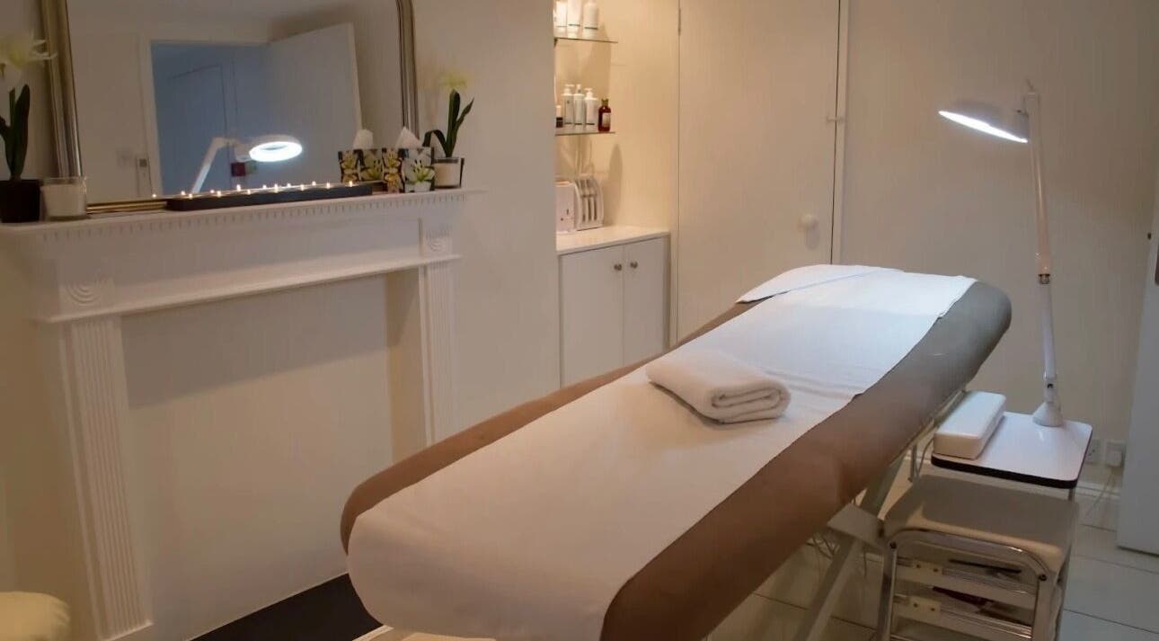 Luxe spa room at Lashes by ANNA in Richmond, England, GB, showcasing a tranquil massage table setup.