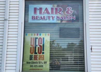 Your Beauty Bazaar Salon & Spa entrance window with open sign at Rochester, New York, US.