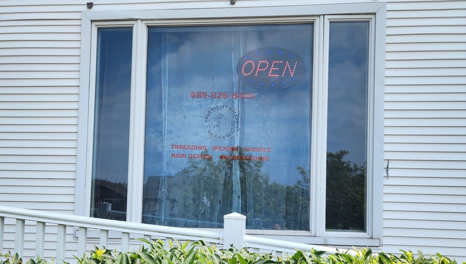 Front view of Your Beauty Bazaar Salon & Spa in Rochester, New York, US with an open sign on the window.