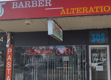 DOAN BARBER $20 storefront in Heidelberg West, Victoria, AU showcasing red signage and open sign.