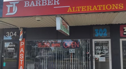 DOAN BARBER $20 storefront in Heidelberg West, Victoria, AU showcasing red signage and open sign.