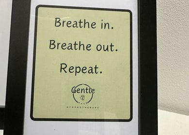Framed motivational sign at A Gentle Pace Hypnotherapy, Newcastle upon Tyne, England, GB reads 'Breathe in, out'.
