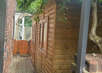 Wooden exterior at A Gentle Pace Hypnotherapy, Newcastle upon Tyne, England, GB, showcasing a serene environment.