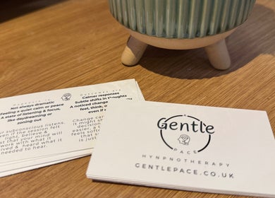 A Gentle Pace Hypnotherapy info cards on a wooden table in Newcastle upon Tyne, England, GB.