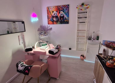 Roxystudio Nails in London, England, GB features a panda art piece and modern nail salon setup.
