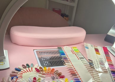 Colorful nail samples under LED light at Roxystudio Nails, London, England, GB, showcasing a vibrant workspace.