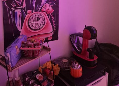 Roxystudio Nails lounge area with a retro phone art and snack setup in London, England, GB.