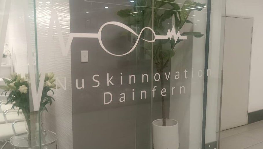 Elegant entrance of NuSkinnovation Dainfern Pty Ltd in Sandton, Gauteng, ZA with modern glass doors.