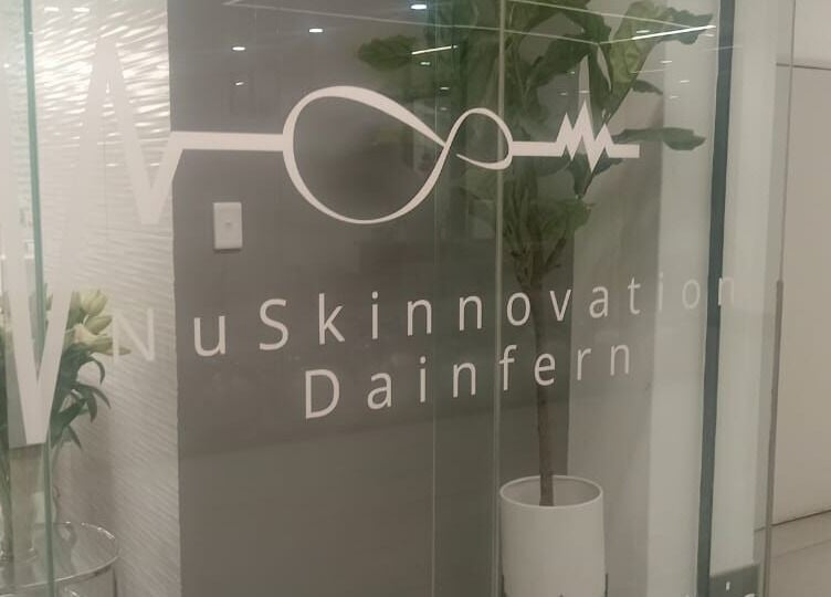 Elegant entrance of NuSkinnovation Dainfern Pty Ltd in Sandton, Gauteng, ZA with modern glass doors.