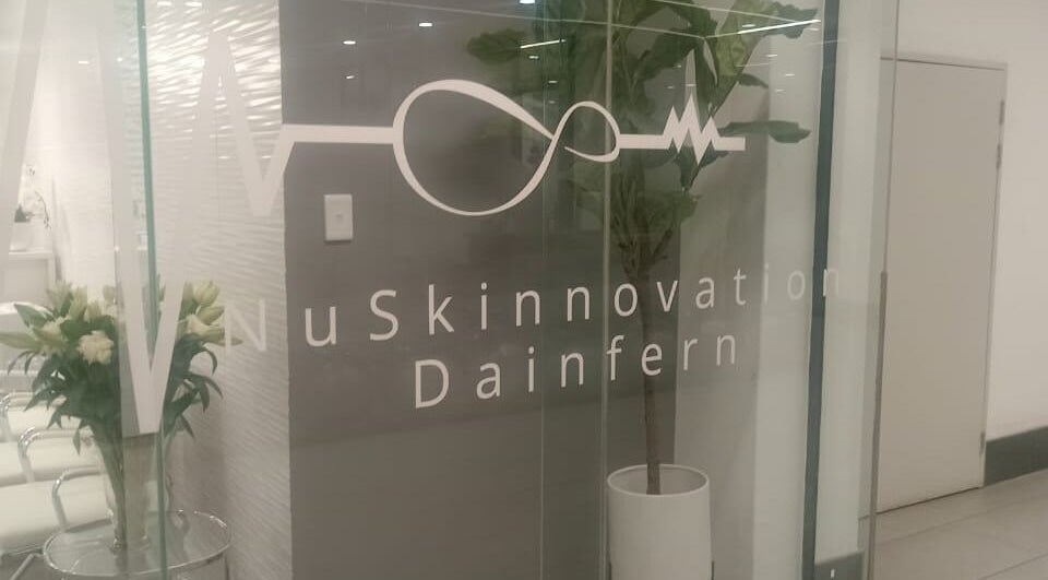 Elegant entrance of NuSkinnovation Dainfern Pty Ltd in Sandton, Gauteng, ZA with modern glass doors.