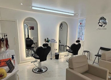 Elegant interior of Glow Beauty Salon in Maidenhead, England, GB with modern styling chairs and mirrors.
