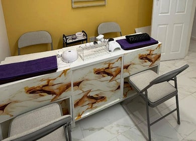 Elegant manicure station at Glow Beauty Salon, Maidenhead, England, GB, with modern decor and cozy seating.