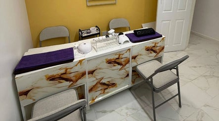 Elegant manicure station at Glow Beauty Salon, Maidenhead, England, GB, with modern decor and cozy seating.