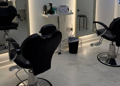Modern salon chairs at Glow Beauty Salon in Maidenhead, England, GB, showcasing sleek interior and elegance.