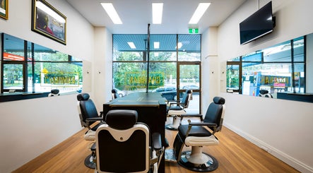 Modern interior of Callum Cuts Hair, Randwick, New South Wales, AU, featuring sleek salon chairs and mirrors.