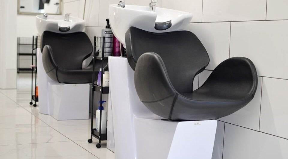 Modern hair wash stations at Perfected Hair and Beauty Studio, Berkeley, England, GB.