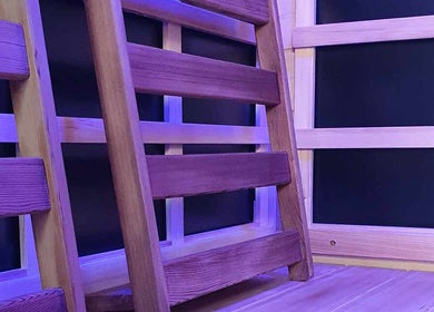 Wooden sauna interior with calming lighting at The Grounding Room, Chatsworth, Queensland, AU.