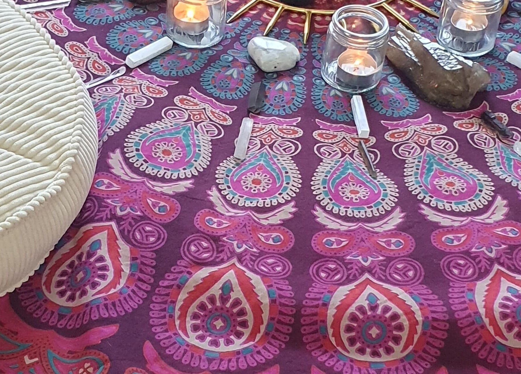 A vibrant mandala cloth with candles at The Grounding Room, Chatsworth, Queensland, AU.