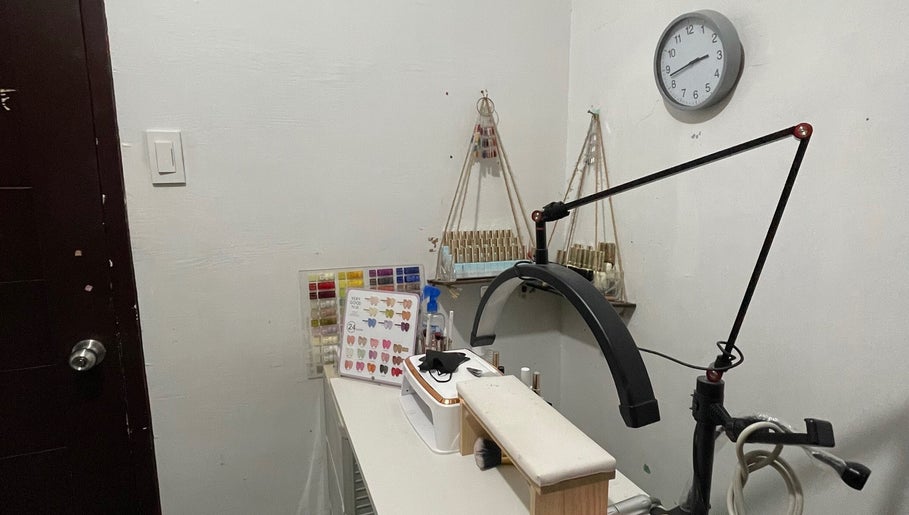 Cozy nail art station at Serene Sparkle, Davao City, Davao Region, PH, featuring manicure tools and supplies.