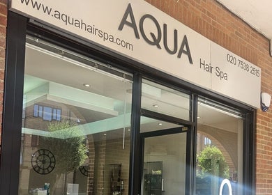 Street view of Nikanails Pro, a chic spa in London, England, GB with a glass front and modern signage.