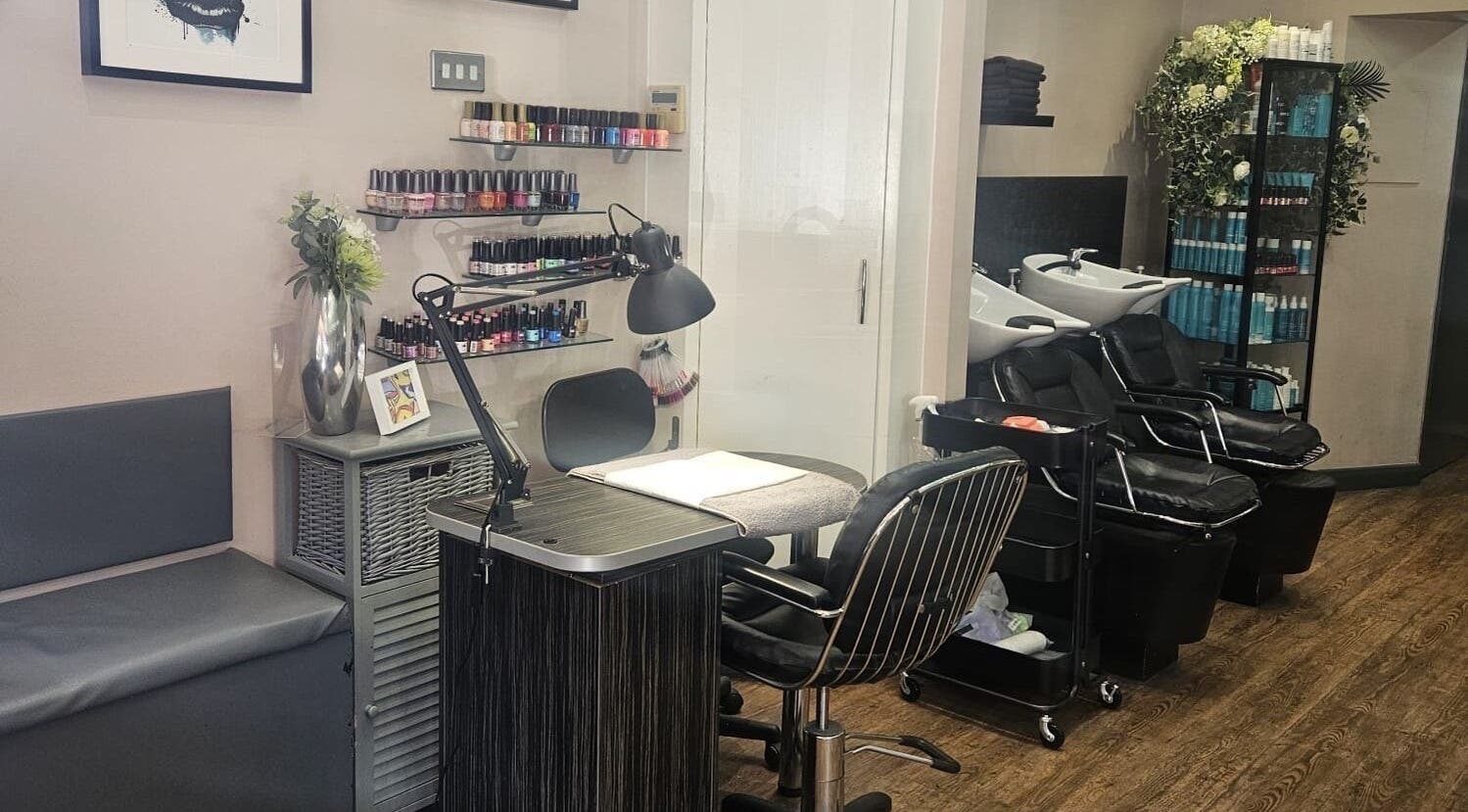 Modern interior of Nikanails Pro nail salon in London, England, GB showcasing stylish manicure and pedicure stations.
