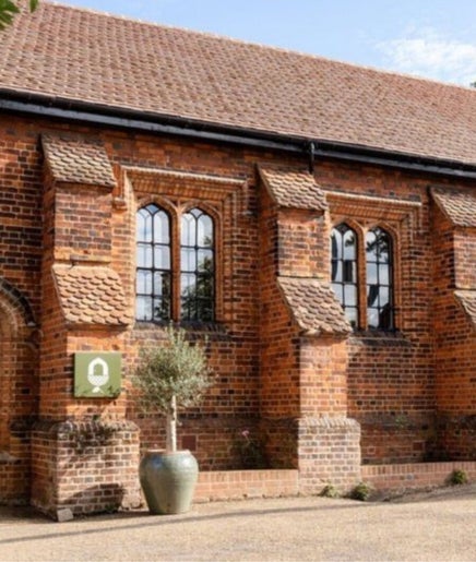 Exterior of Molten&Muse Clinic in a charming brick building, Hatfield, England, GB.