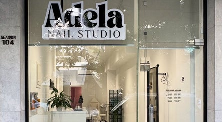 Front entrance of Adela nail studio in Thessaloniki, GR, showcasing a welcoming interior design.