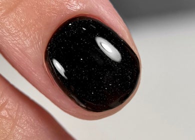 Elegant black manicure with a glossy finish at Adela nail studio, Thessaloniki, GR.