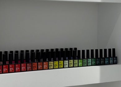 Colorful nail polish bottles neatly displayed at Adela nail studio, Thessaloniki, GR.