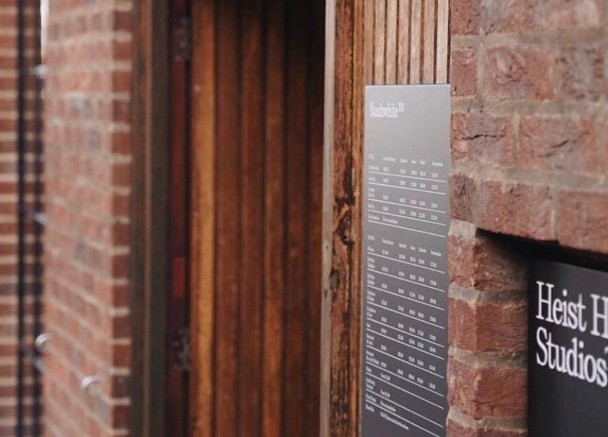 Entrance of Elaine Sadler Skin Health in Warwick, England, GB with visible brick walls and signs.